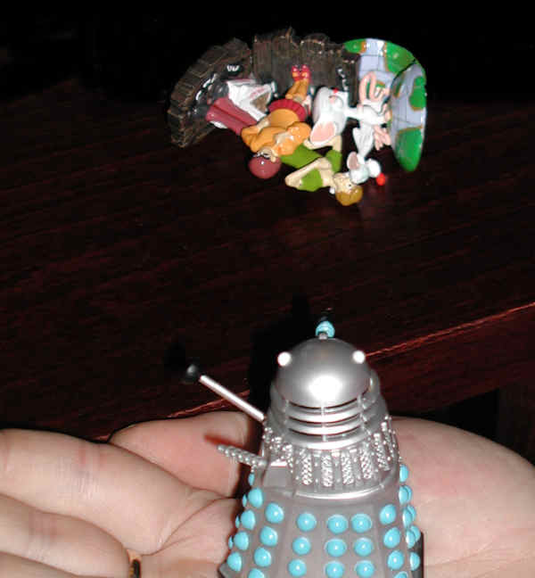 Mr. Dalek looks at the pile of corpses