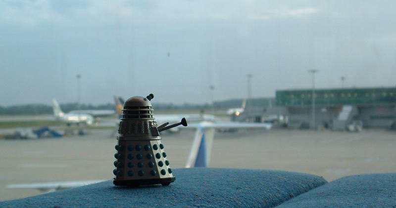 Mr. Dalek looks at the landed aeroplanes